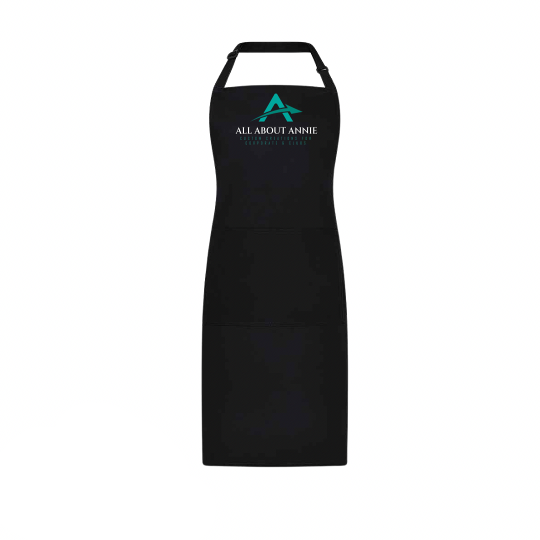 A black branded apron with the logo 'All About Annie' printed on the chest area.
