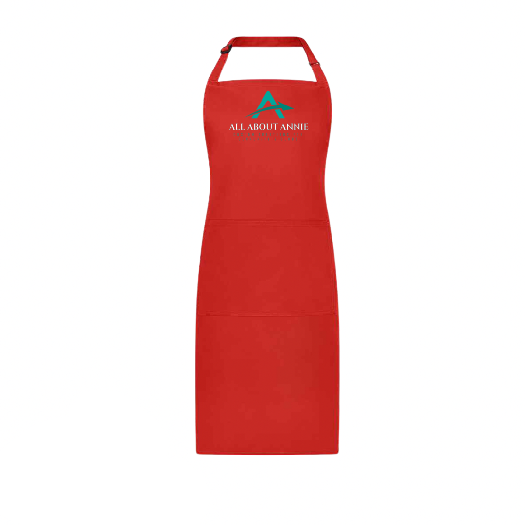 A black branded apron with the logo 'All About Annie' printed on the chest area.